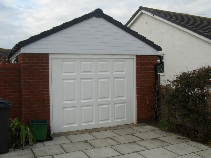 Photo - Garage and Landscaping (1 of 3) - Brick built garage for Blackpool customer, with UPVC soffits, fascias and guttering, pan tile roof, electrics and a remote control glass fibre door. - Extensions - Home - © J C Joinery