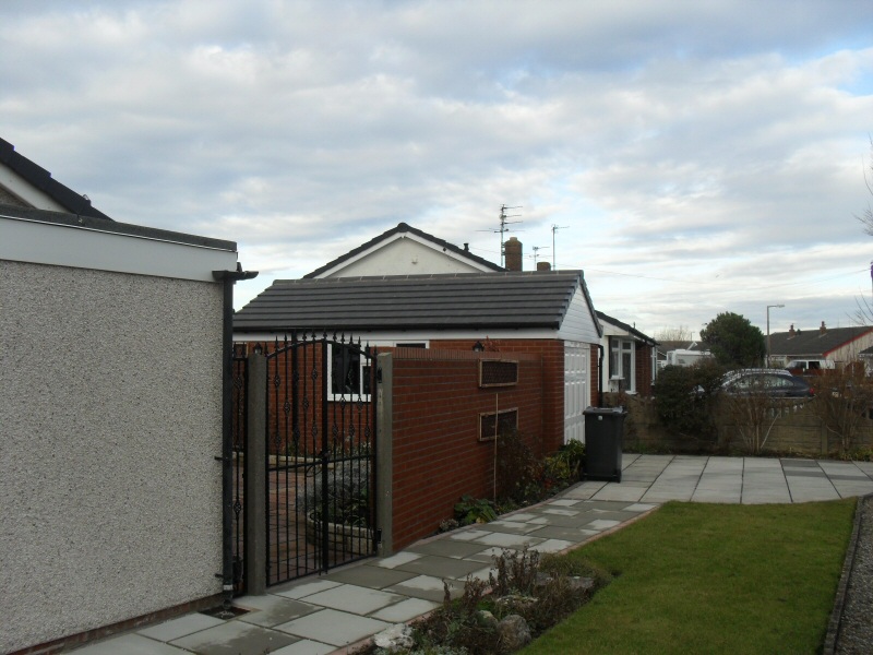 Photo - Garage and Landscaping (2 of 3) - Landscaping including a brick wall, bespoke wrought iron gates and flagged path and driveway. - Extensions - Home - © J C Joinery