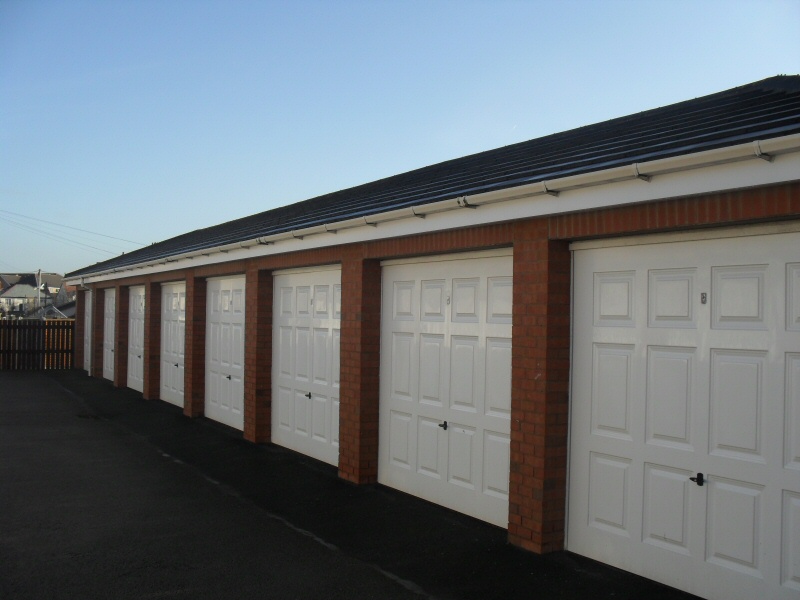 Photo - Garage Doors (1 of 1) - Some of the 29 garage doors fitted at Admirals Sound, Cleveleys. Georgian style glass re-inforced polyester (GRP) up and over doors, some with remote control. - Garage Doors - Home - © J C Joinery